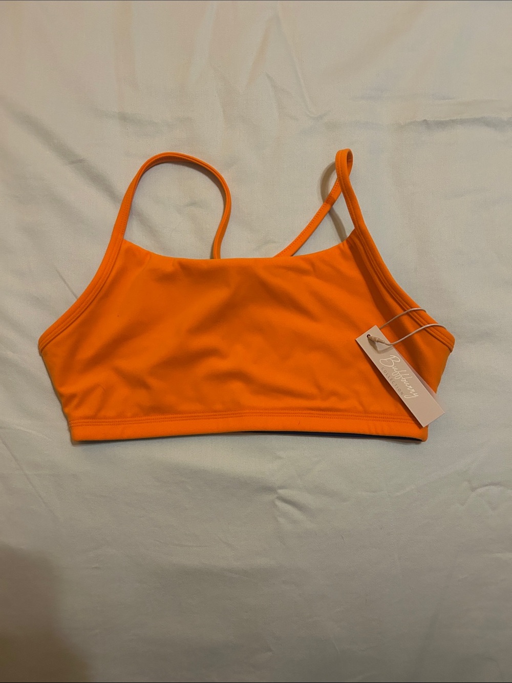 Buffbunny Sports Bra in orange + blue NWT